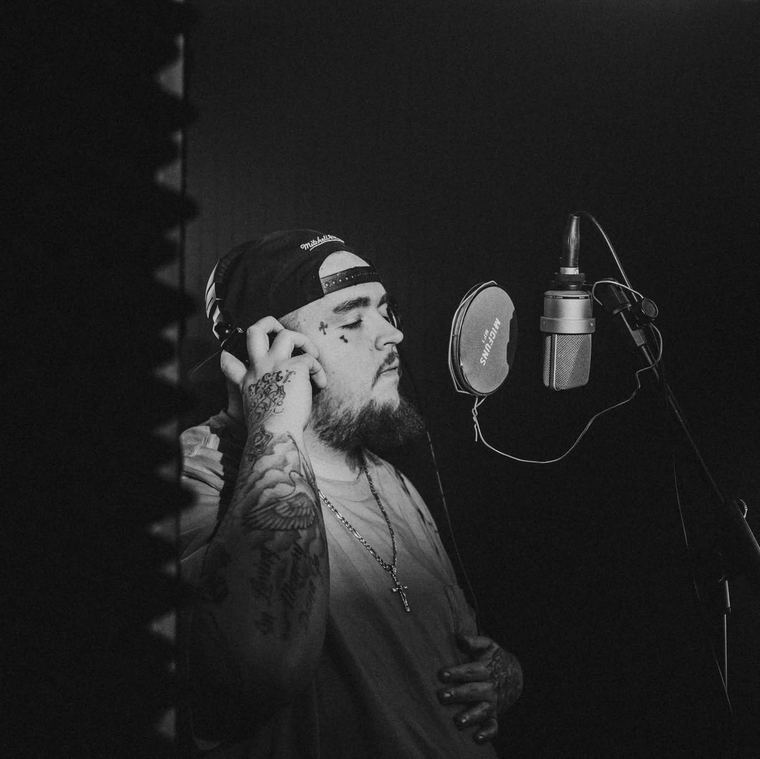 Black and white, eyes closed at the mic