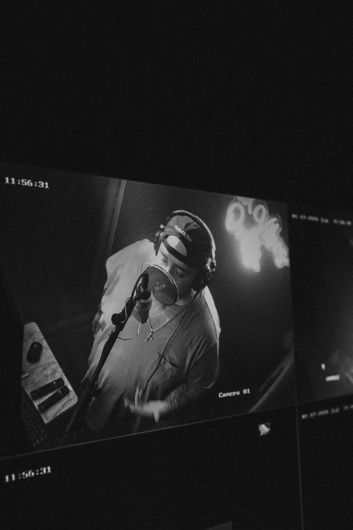 Black and white studio camera feed from above