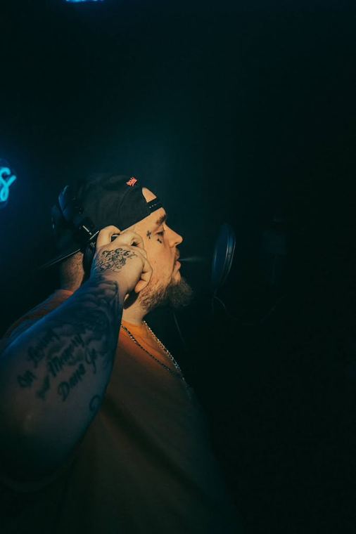 Side profile with headphones in the dark