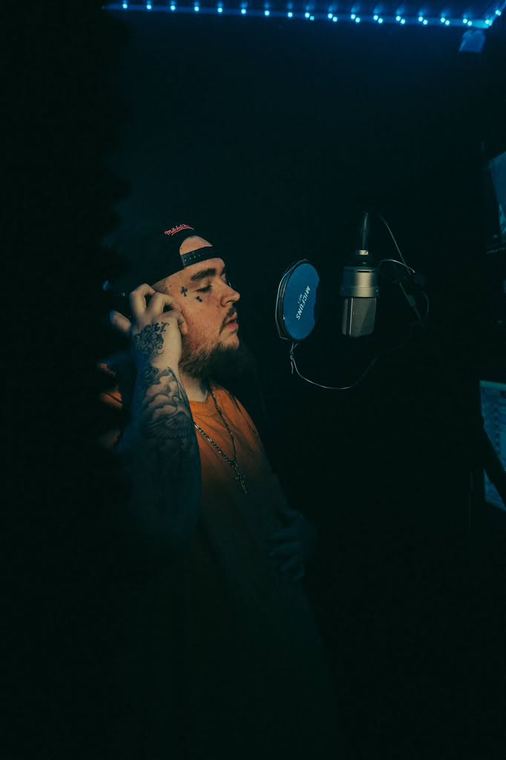 Profile at the mic, eyes closed