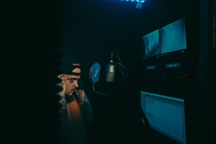 In the dark booth with the session on screen